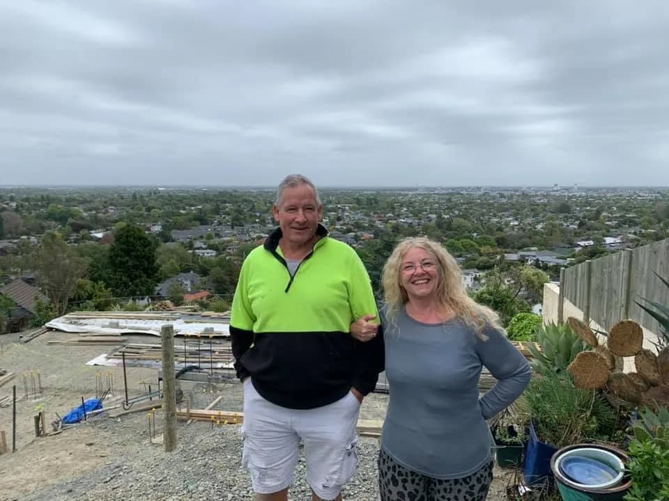 Verna and Paul McFelin at home, with Christchurch spread out behind them